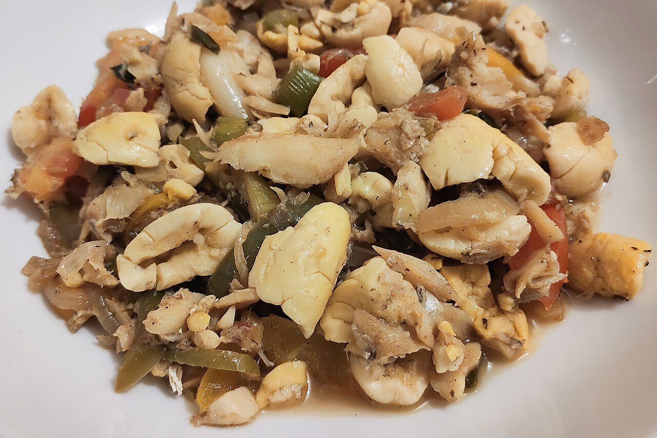 Ackee and saltfish with onion, tomato and herbs
